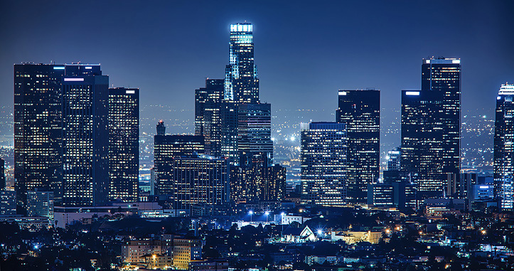 Nighttime city landscape featuring skyscrapers