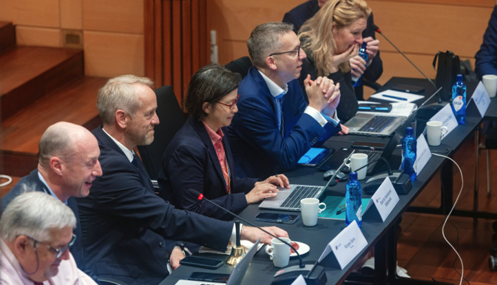 Delegates sitting at a panel session